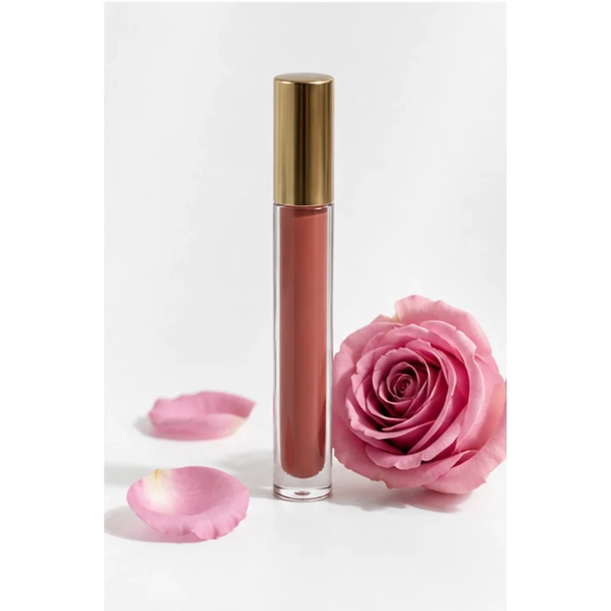 Rose-brown tube of Serey Skin Rosewater Lip Tint with a pink rose