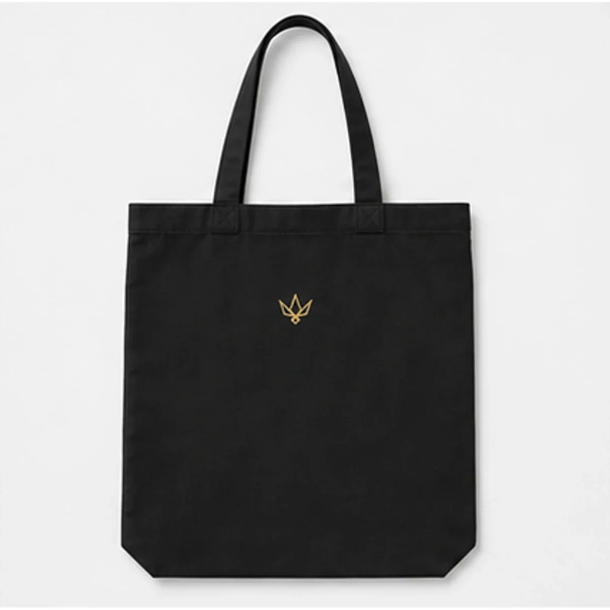 Structured black Vannak Live canvas tote with a small gold emblem